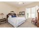 Bright bedroom with large bed and plush carpeting, offering a comfortable and tranquil retreat at 2457 E Melrose St, Mesa, AZ 85213