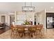 Cozy dining room offers a seamless transition into the kitchen, perfect for entertaining guests at 2457 E Melrose St, Mesa, AZ 85213
