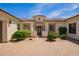 A front exterior showcasing well-manicured landscaping and a paver driveway to the home's entrance at 2457 E Melrose St, Mesa, AZ 85213