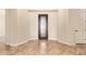 Elegant foyer with neutral walls, tile flooring, and a decorative wrought iron front door at 2457 E Melrose St, Mesa, AZ 85213