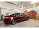 Garage with epoxy floors, ample storage cabinets, and lots of space for parking at 2457 E Melrose St, Mesa, AZ 85213