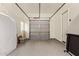 Clean garage featuring epoxy floors, windows, and ample storage space at 2457 E Melrose St, Mesa, AZ 85213