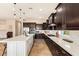 Gourmet kitchen offering tons of countertop space, stainless steel appliances, and dark wood cabinetry at 2457 E Melrose St, Mesa, AZ 85213