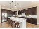 Bright kitchen with a large island, stainless steel appliances, and ample counter space for meal preparation at 2457 E Melrose St, Mesa, AZ 85213