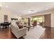Inviting living room with an open floor plan that showcases abundant natural light and flows into other areas at 2457 E Melrose St, Mesa, AZ 85213