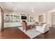 Cozy living room with built-in shelves, fireplace, wood floors, and comfortable seating at 2457 E Melrose St, Mesa, AZ 85213