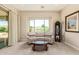 Bright living room featuring neutral color scheme, comfortable seating, and a view of the manicured garden at 2457 E Melrose St, Mesa, AZ 85213