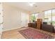 Bright office with hardwood floors and a vintage rug at 2457 E Melrose St, Mesa, AZ 85213