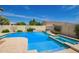 Inviting pool with raised spa and custom tilework, perfect for relaxation and entertaining at 2457 E Melrose St, Mesa, AZ 85213