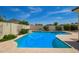 Backyard featuring a refreshing pool with a tile surround and lush landscaping at 2457 E Melrose St, Mesa, AZ 85213