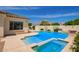 Sparkling pool and spa with travertine tile surround in a private backyard oasis at 2457 E Melrose St, Mesa, AZ 85213
