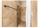 Tiled walk-in shower with a built-in seat and a modern showerhead at 2457 E Melrose St, Mesa, AZ 85213