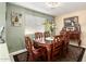 Elegant dining room featuring a wooden table set with seating for six and chandelier lighting at 25806 W Hilton Ave, Buckeye, AZ 85326