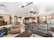 Open-concept living area, showcasing a comfortable sectional sofa adjacent to the kitchen at 25806 W Hilton Ave, Buckeye, AZ 85326