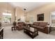 Spacious living room with vaulted ceiling, neutral decor, and plush seating at 25806 W Hilton Ave, Buckeye, AZ 85326
