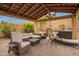 Inviting outdoor patio with comfortable seating, perfect for relaxing or entertaining guests at 25806 W Hilton Ave, Buckeye, AZ 85326