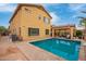 Private backyard pool and covered patio, perfect for outdoor entertaining and relaxation at 25806 W Hilton Ave, Buckeye, AZ 85326