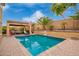 Backyard pool and covered patio area offering a private and refreshing outdoor experience at 25806 W Hilton Ave, Buckeye, AZ 85326