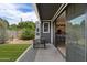 Inviting backyard with a covered patio, well-kept lawn, and sliding door access to inside at 2604 N 27Th St # 4, Phoenix, AZ 85008
