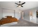 Spacious bedroom with neutral walls, carpet, ceiling fan, and ensuite bathroom at 2604 N 27Th St # 4, Phoenix, AZ 85008