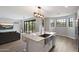 Open-concept kitchen features an island, stainless steel appliances, and a seamless flow to the living area and outdoor patio at 2604 N 27Th St # 4, Phoenix, AZ 85008