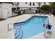 Community pool area showcasing a pristine pool with lounge chairs and accessibility features at 2604 N 27Th St # 4, Phoenix, AZ 85008