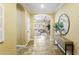 Inviting entryway featuring neutral paint, arched doorway, tile floors, and views into the living space at 2736 E Sourwood Dr, Gilbert, AZ 85298