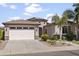Charming single-story home with a desert landscape, two-car garage, and a beautiful tile roof at 2736 E Sourwood Dr, Gilbert, AZ 85298