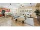 Bright living room with tile floors, neutral furniture, ceiling fan, and lots of natural light at 2736 E Sourwood Dr, Gilbert, AZ 85298