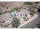 Stunning aerial view of a desert home featuring a sparkling blue pool and spacious backyard oasis at 29110 N 24Th Ln, Phoenix, AZ 85085