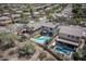 Overhead view of a property highlighting a pool, putting green, and outdoor entertainment area at 29110 N 24Th Ln, Phoenix, AZ 85085