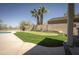 A lush putting green and outdoor seating area makes this backyard an oasis at 29110 N 24Th Ln, Phoenix, AZ 85085