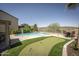 Beautiful home backyard with inviting pool and well-manicured putting green at 29110 N 24Th Ln, Phoenix, AZ 85085