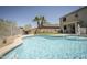 Backyard with a sparkling pool and a putting green, perfect for outdoor living at 29110 N 24Th Ln, Phoenix, AZ 85085