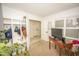 Cozy bedroom with a storage and display cabinet, light-filled windows, and neutral carpet at 29110 N 24Th Ln, Phoenix, AZ 85085