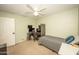 This bedroom is carpeted and features a ceiling fan, providing a blank canvas for customization at 29110 N 24Th Ln, Phoenix, AZ 85085