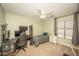 Versatile bedroom space features carpet, a ceiling fan, and an abundance of natural light at 29110 N 24Th Ln, Phoenix, AZ 85085