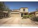 Charming two-story home with a well-manicured front yard, desert landscaping, and a two-car garage at 29110 N 24Th Ln, Phoenix, AZ 85085