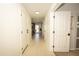 Bright hallway featuring neutral tile, white doors, and recessed lighting at 29110 N 24Th Ln, Phoenix, AZ 85085