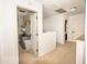 Open hallway featuring carpet floors and access to a bedroom with blue furnishings at 29110 N 24Th Ln, Phoenix, AZ 85085