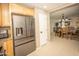 Open kitchen with stainless steel appliances and direct view into the dining and living areas at 29110 N 24Th Ln, Phoenix, AZ 85085