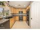 Well-equipped kitchen with stainless steel appliances, granite countertops, and ample cabinet space at 29110 N 24Th Ln, Phoenix, AZ 85085