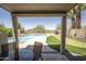 Covered patio offers lovely views of the backyard pool and putting green at 29110 N 24Th Ln, Phoenix, AZ 85085