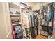 Organized walk-in closet with shelves and rods providing ample storage space at 29110 N 24Th Ln, Phoenix, AZ 85085