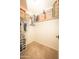 Spacious walk-in closet with carpet flooring, storage shelves and hanging rods at 29110 N 24Th Ln, Phoenix, AZ 85085