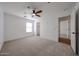 Bedroom features plush carpet, ceiling fan and has access to a walk-in closet at 29270 W Weldon Ave, Buckeye, AZ 85396