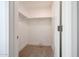 Interior of a walk-in closet with carpeted floors and white shelving at 29270 W Weldon Ave, Buckeye, AZ 85396