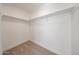 This walk-in closet features neutral carpet and shelving for optimal organization at 29270 W Weldon Ave, Buckeye, AZ 85396