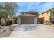 Charming two-story home features a two-car garage and desert landscaping at 29270 W Weldon Ave, Buckeye, AZ 85396