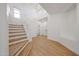 Bright foyer featuring a staircase, and wood-look floors throughout at 29270 W Weldon Ave, Buckeye, AZ 85396